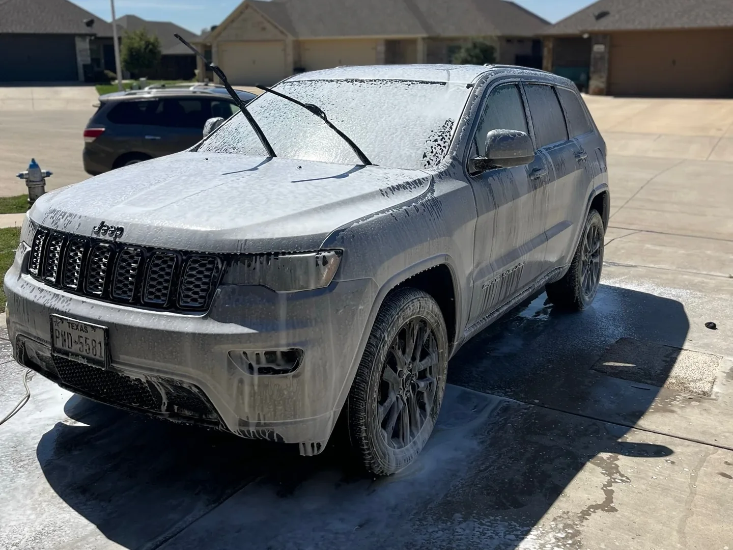 Jeep Grand Cherokee covered in foam during mobile detailing